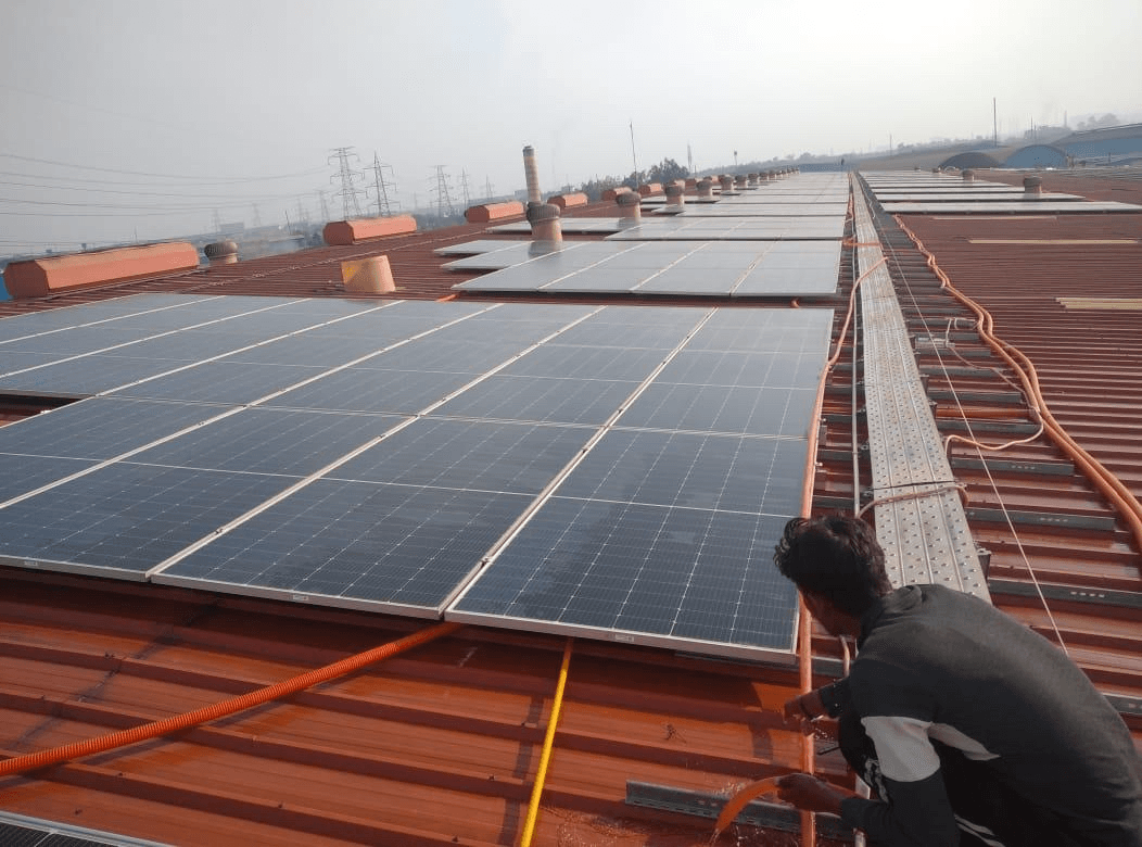 Tirupati Solar Tech installation team and completed rooftop system